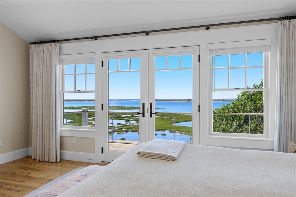 246 Stage Island Road Chatham, MA 02633 - Photo 25 of 37 a view of an empty room with a window