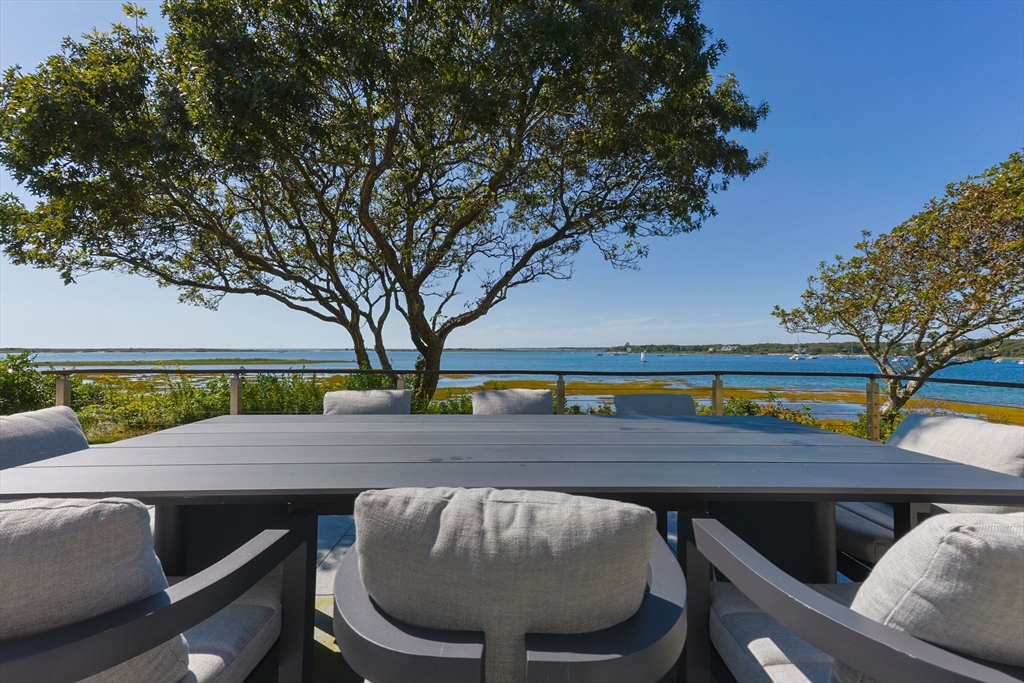 246 Stage Island Road Chatham, MA 02633 - Photo 29 of 37 a view of a chairs and table in the patio