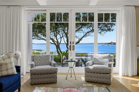 a living room with furniture and windows