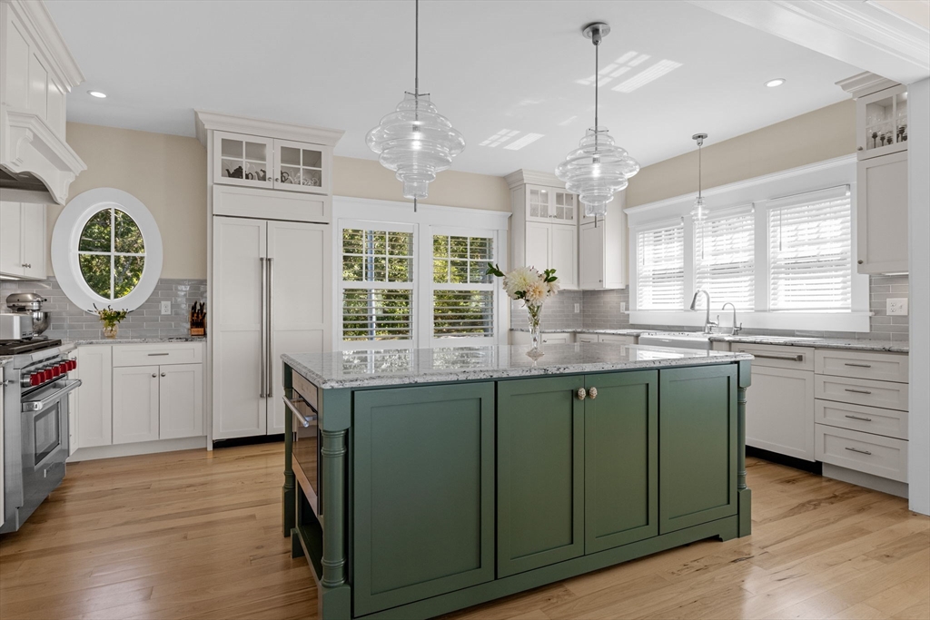246 Stage Island Road Chatham, MA 02633 - Photo 10 of 37 a kitchen with stainless steel appliances granite countertop a stove a sink and a wooden floors