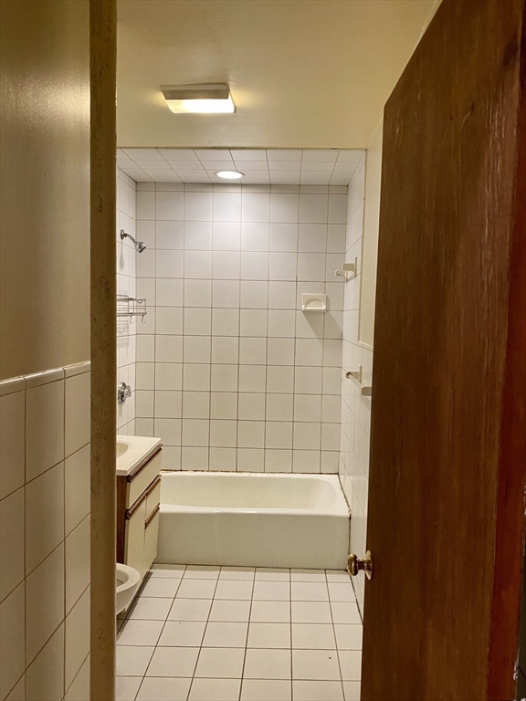 16 Royce Road, Unit 4 Boston, MA 02134 - Photo 3 of 4 a bathroom with a bathtub and shower