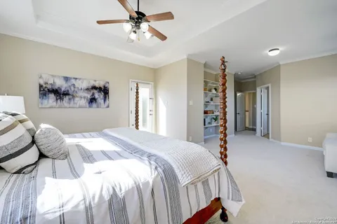 a spacious bedroom with a bed and a window