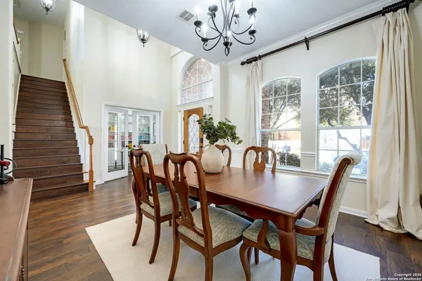 a view of a dining room with furniture window and wooden floor