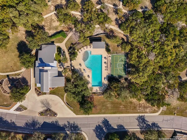 an aerial view of a house with a yard