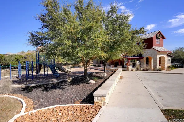 a swimming pool with outdoor seating and yard