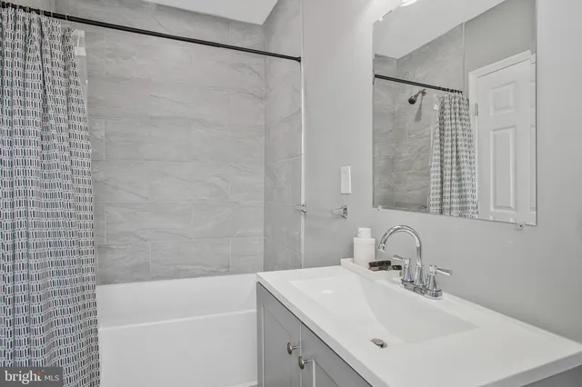 a bathroom with a sink and a bathtub