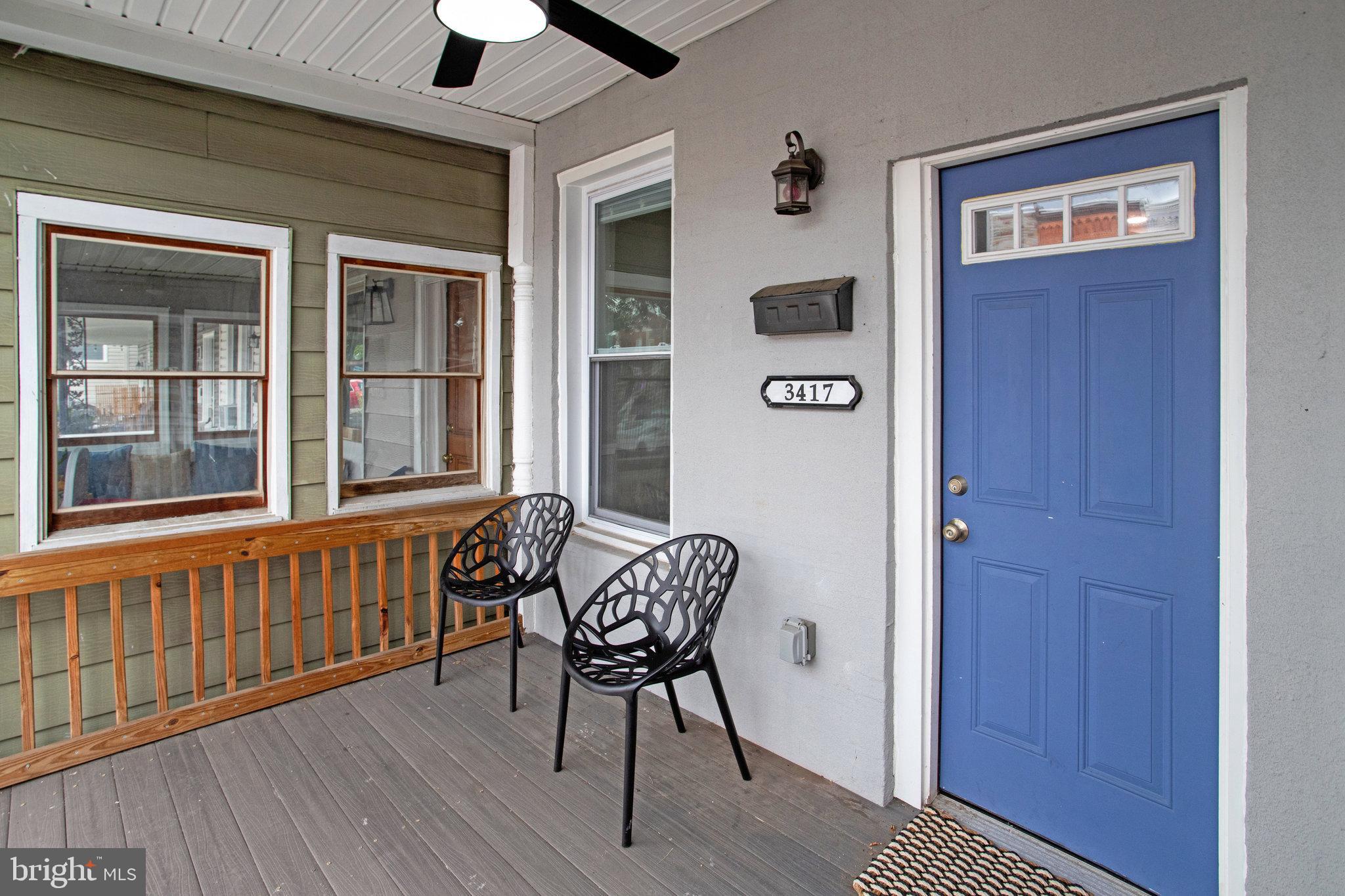 3417 Chestnut Avenue Baltimore, MD 21211 - Photo 2 of 14 a view of a hallway with wooden floor and windows