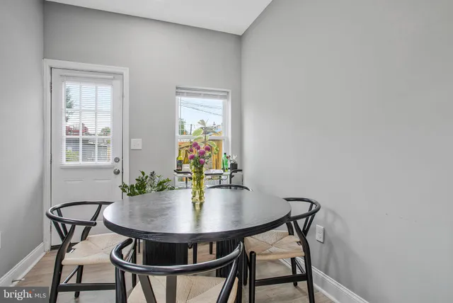 a dining room with furniture and window