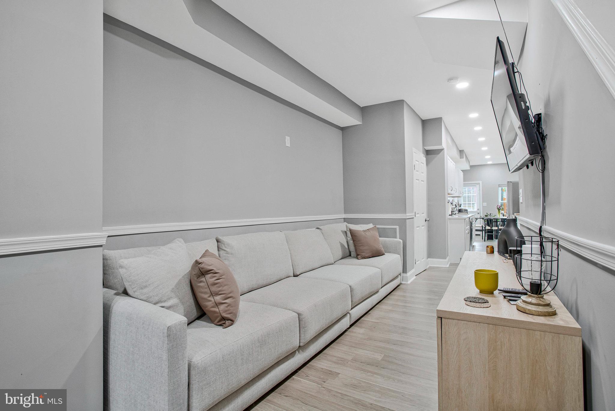 3417 Chestnut Avenue Baltimore, MD 21211 - Photo 5 of 14 a living room with furniture and a couch