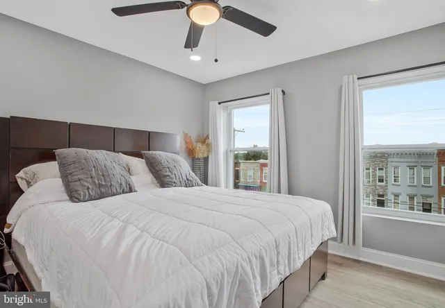 a bedroom with a large bed and a window