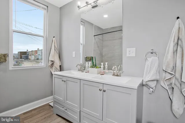 a bathroom with a sink and a mirror