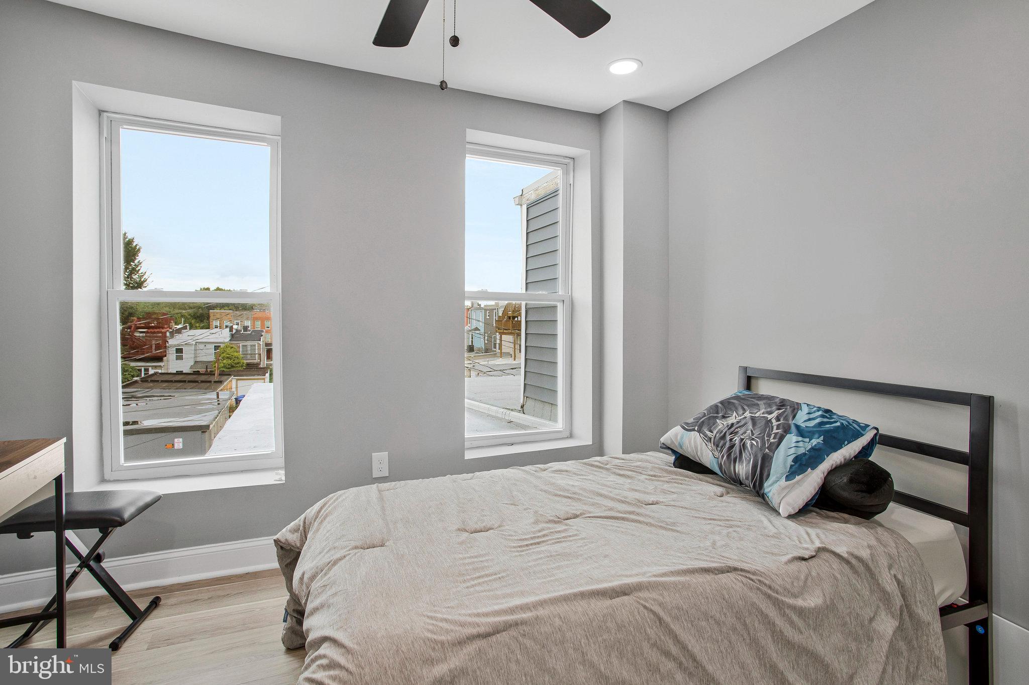 3417 Chestnut Avenue Baltimore, MD 21211 - Photo 10 of 14 a bedroom with a bed and a window