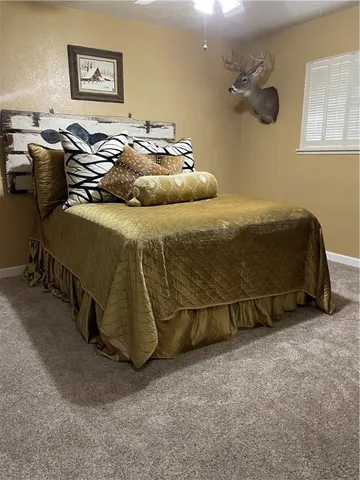 a bedroom with a bed and chair