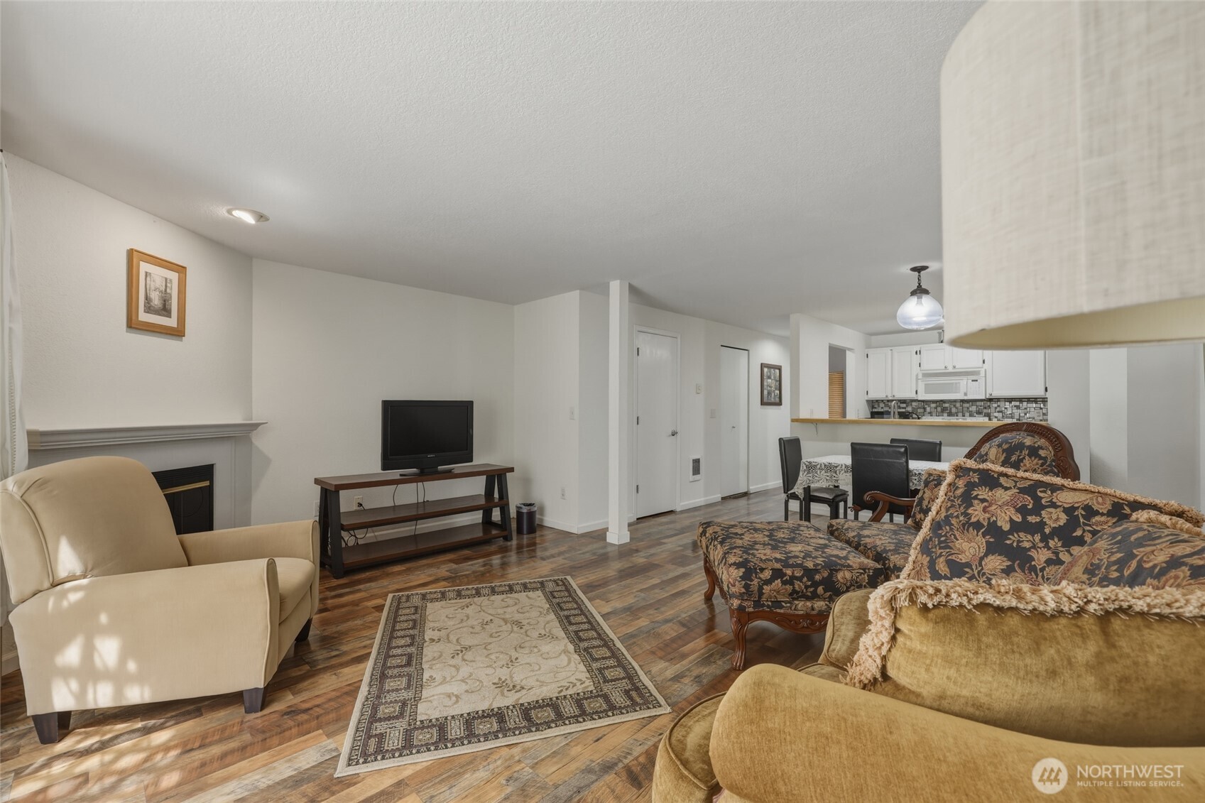 6005 Merlot Lane Southeast Lacey, WA 98513 - Photo 20 of 37 a living room with furniture and a flat screen tv