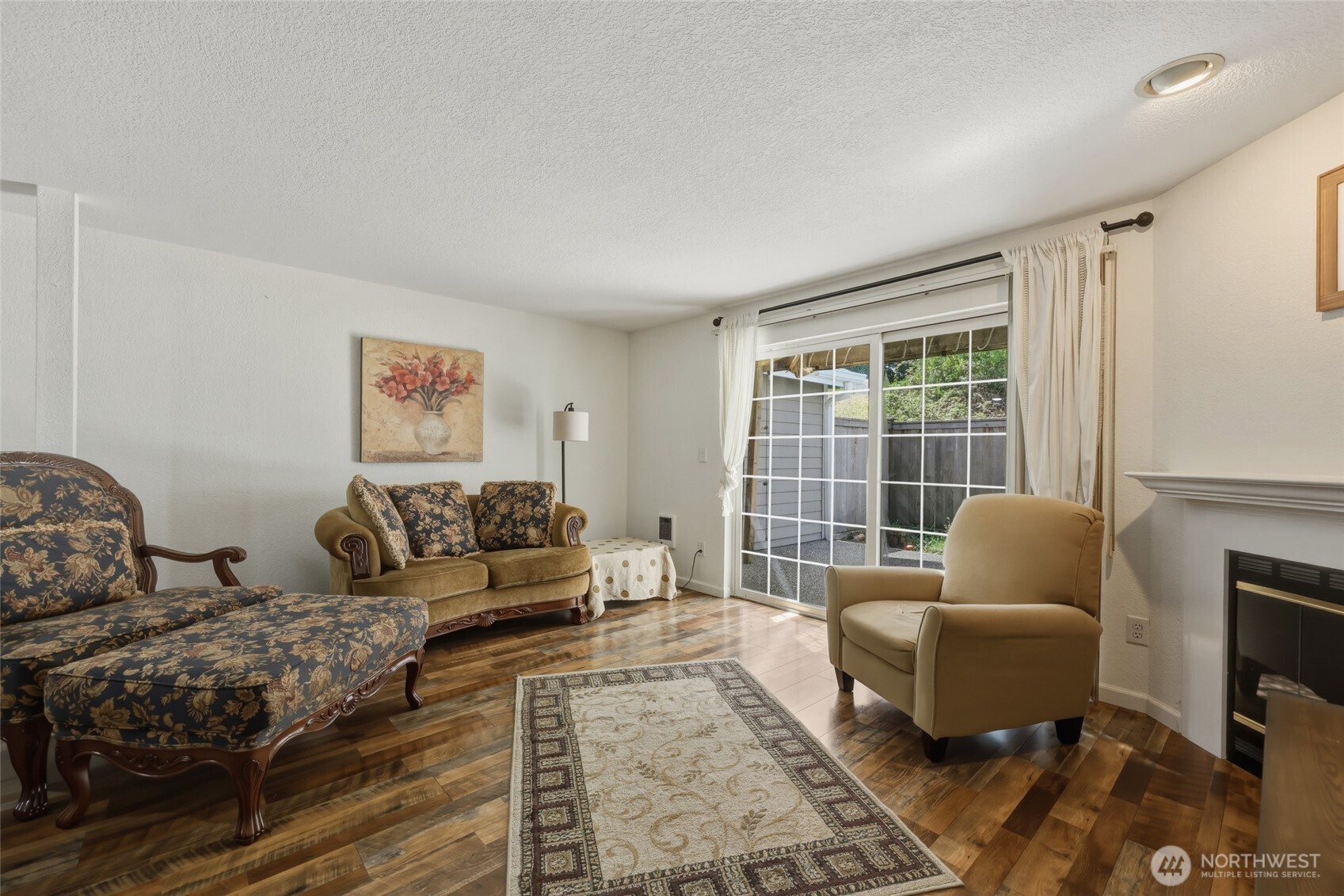 6005 Merlot Lane Southeast Lacey, WA 98513 - Photo 21 of 37 a living room with furniture and a fireplace