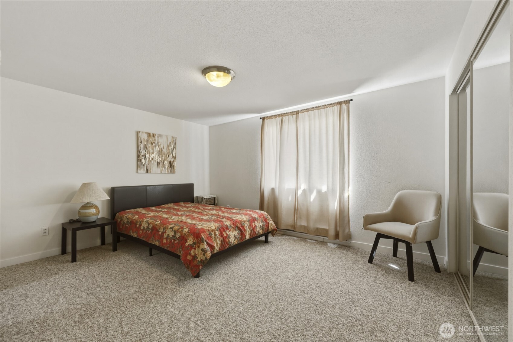 6005 Merlot Lane Southeast Lacey, WA 98513 - Photo 25 of 37 a bedroom with a bed and a chair