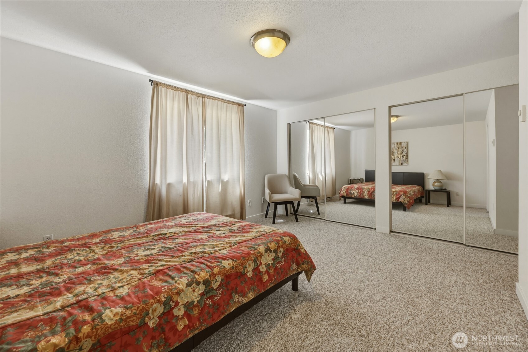 6005 Merlot Lane Southeast Lacey, WA 98513 - Photo 26 of 37 a bedroom with a bed and a chandelier