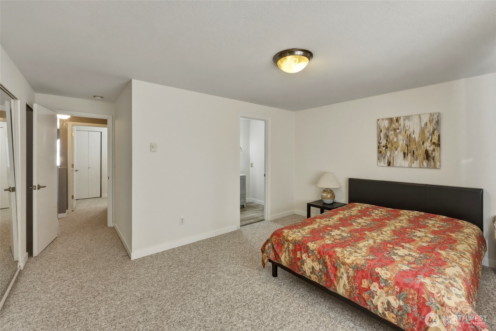 6005 Merlot Lane Southeast Lacey, WA 98513 - Photo 27 of 37 a bedroom with a bed and painting on the wall