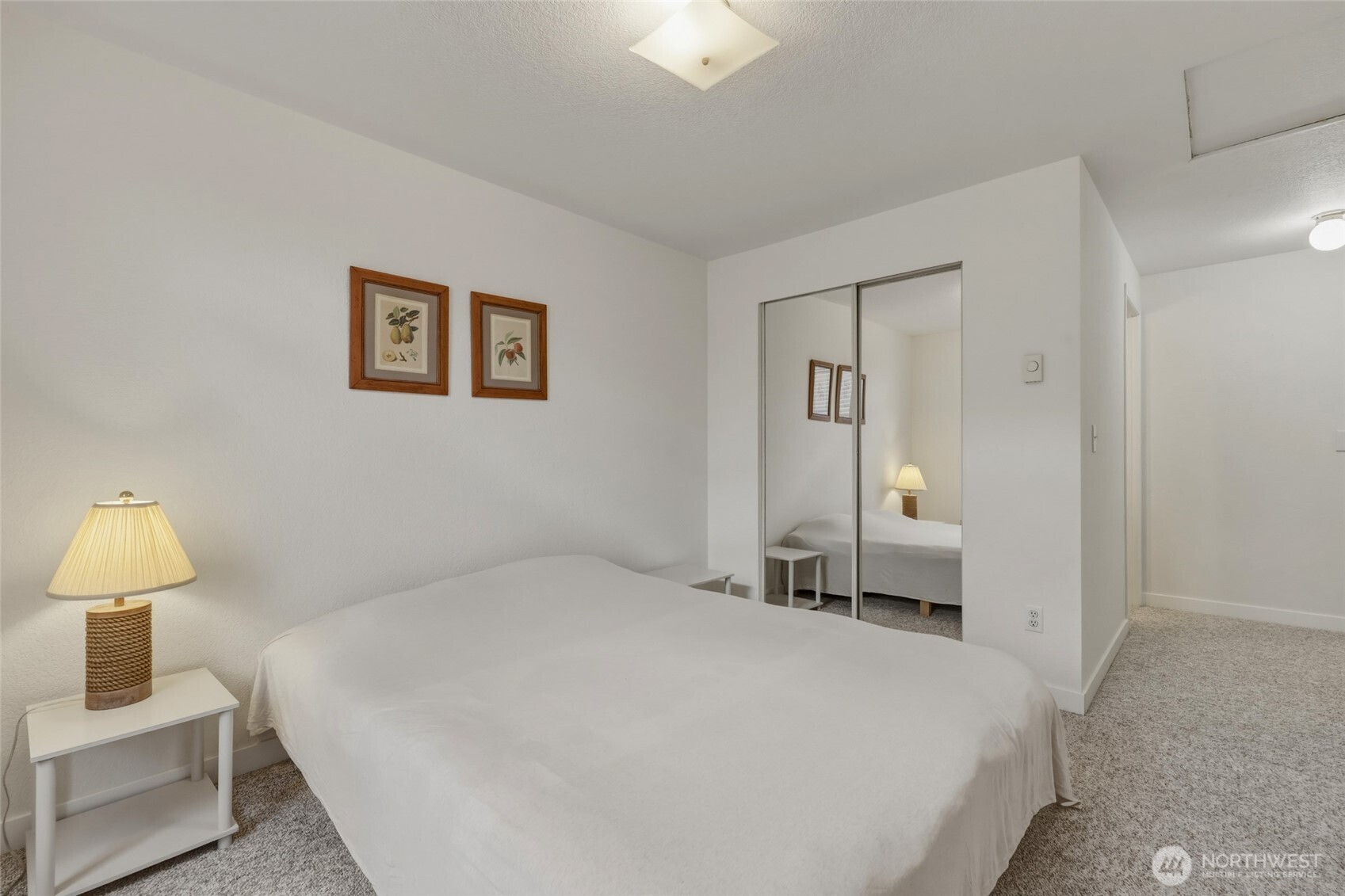 6005 Merlot Lane Southeast Lacey, WA 98513 - Photo 31 of 37 a bedroom with a bed and a lamp