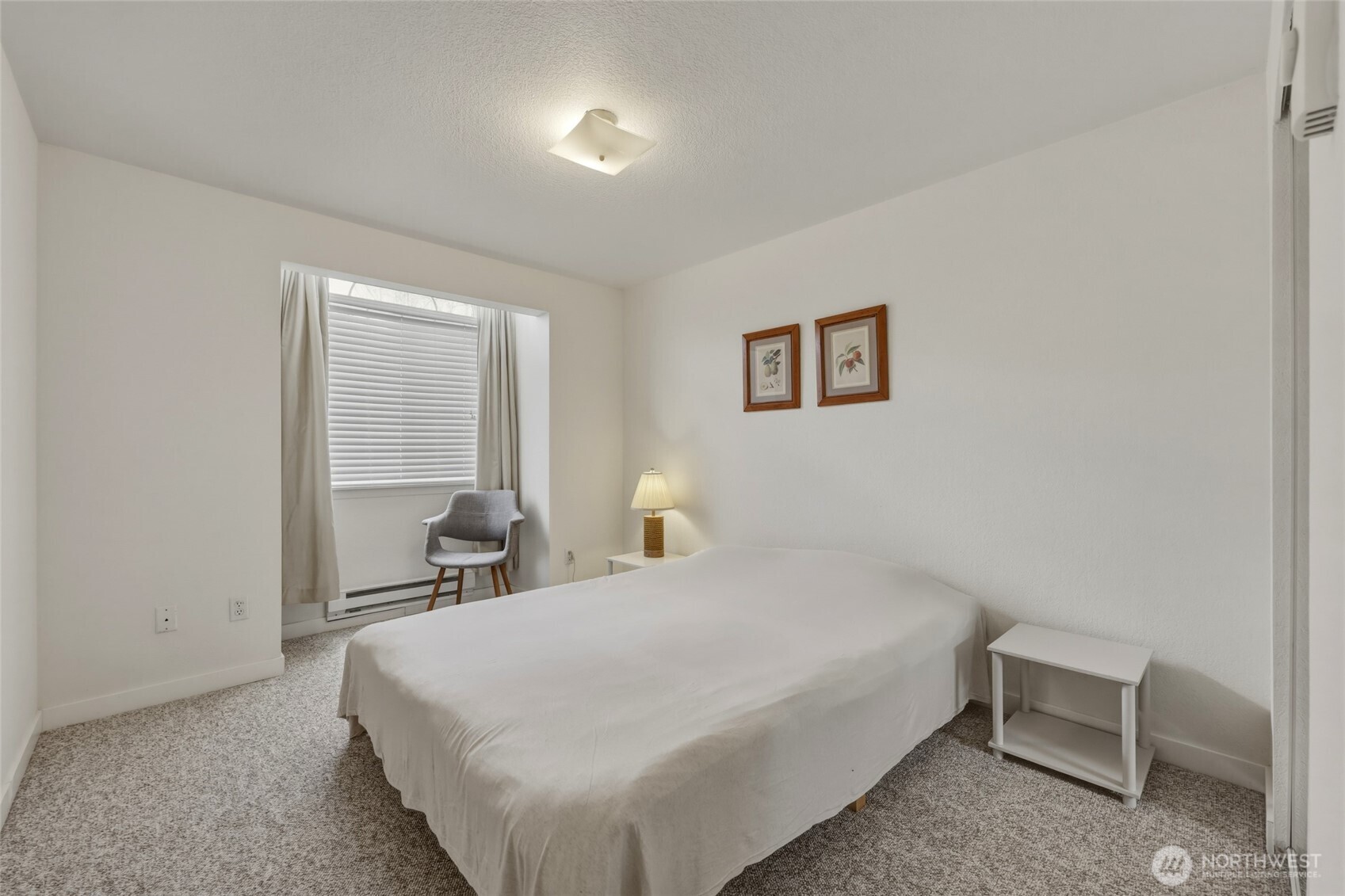 6005 Merlot Lane Southeast Lacey, WA 98513 - Photo 32 of 37 a bedroom with a bed and a chair