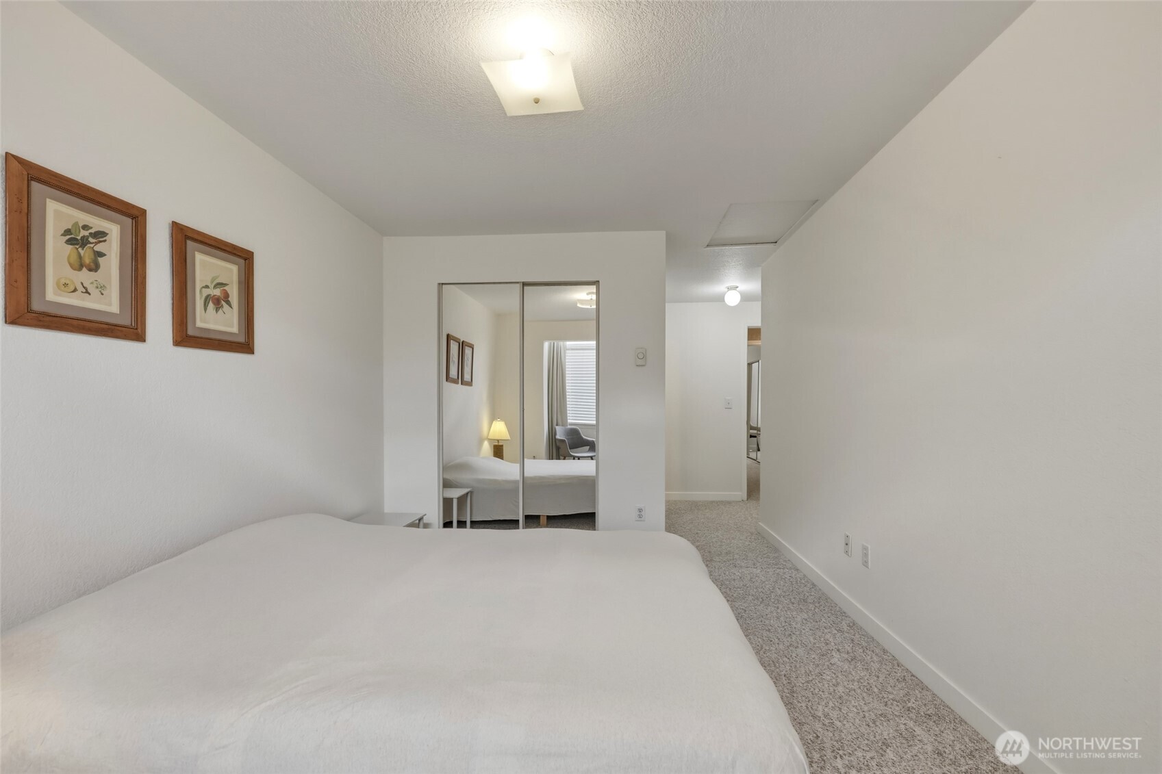6005 Merlot Lane Southeast Lacey, WA 98513 - Photo 33 of 37 a large white bed in a white room