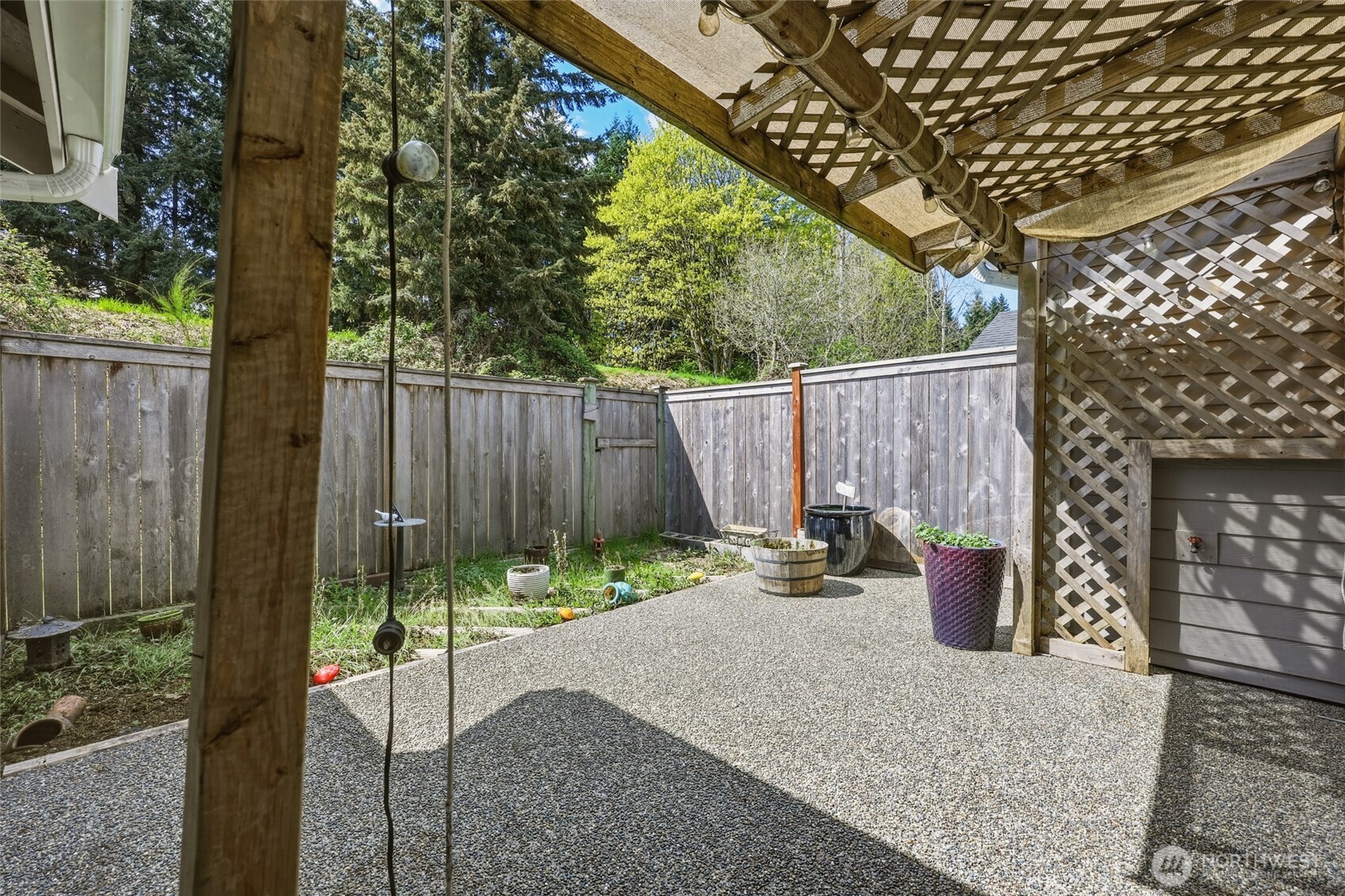 6005 Merlot Lane Southeast Lacey, WA 98513 - Photo 7 of 37 a backyard of a house with table and chairs