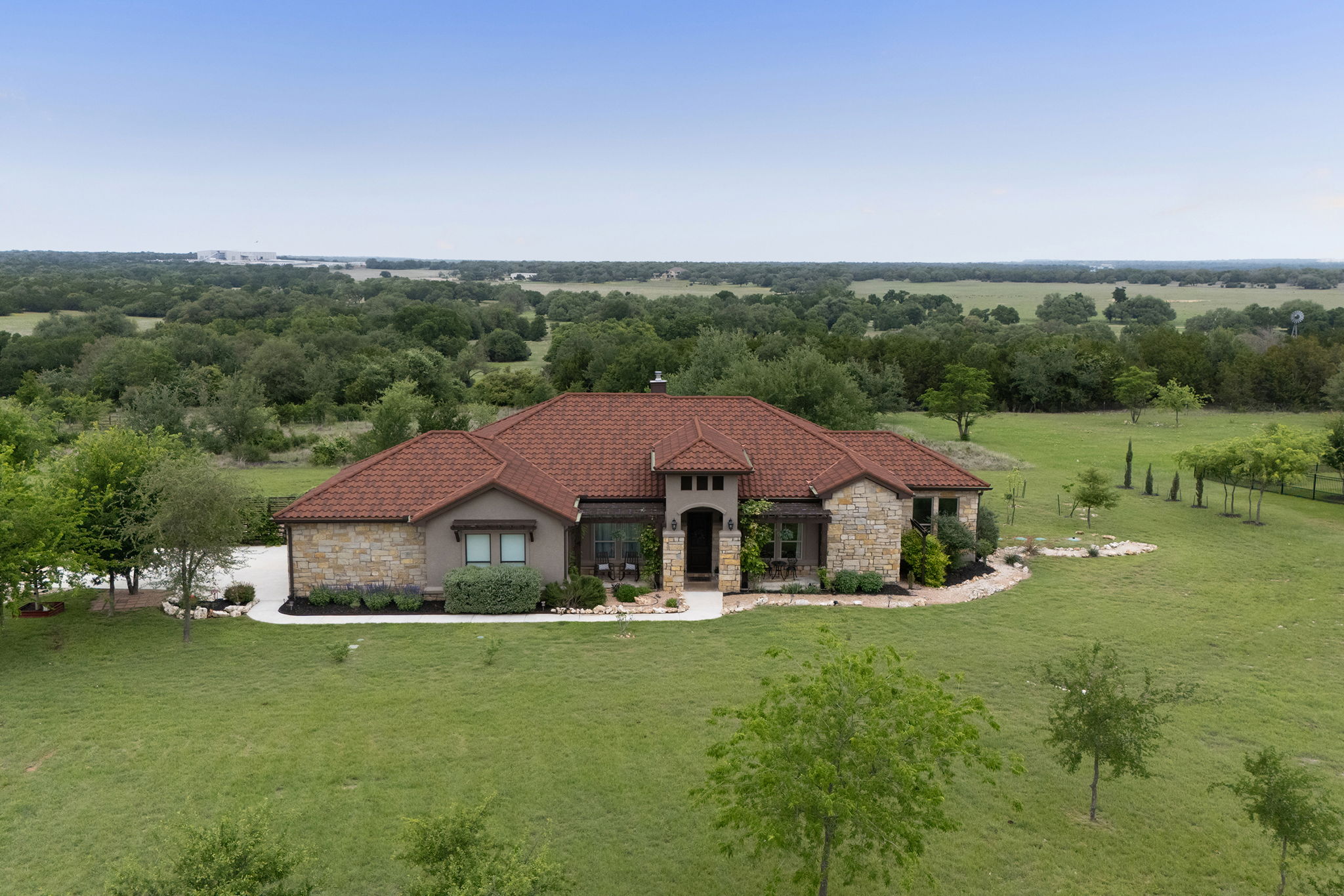 128 Strada Luca Florence, TX 76527 - Photo 2 of 40 Single-story home on a large, open lot with expansive green space, mature trees, and peaceful countryside views.