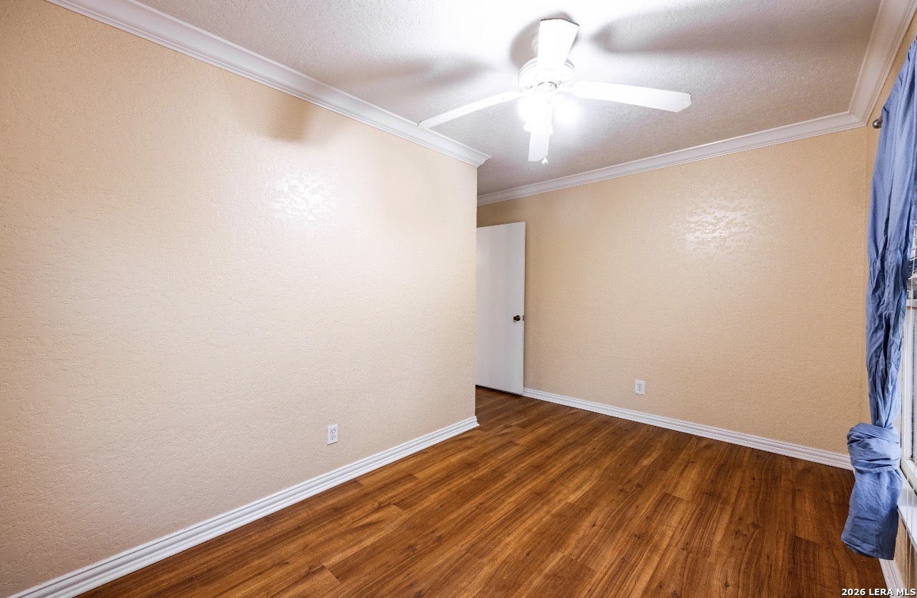 149 South Carroll Street Poth, TX 78147 - Photo 13 of 28 a view of room with wooden floor