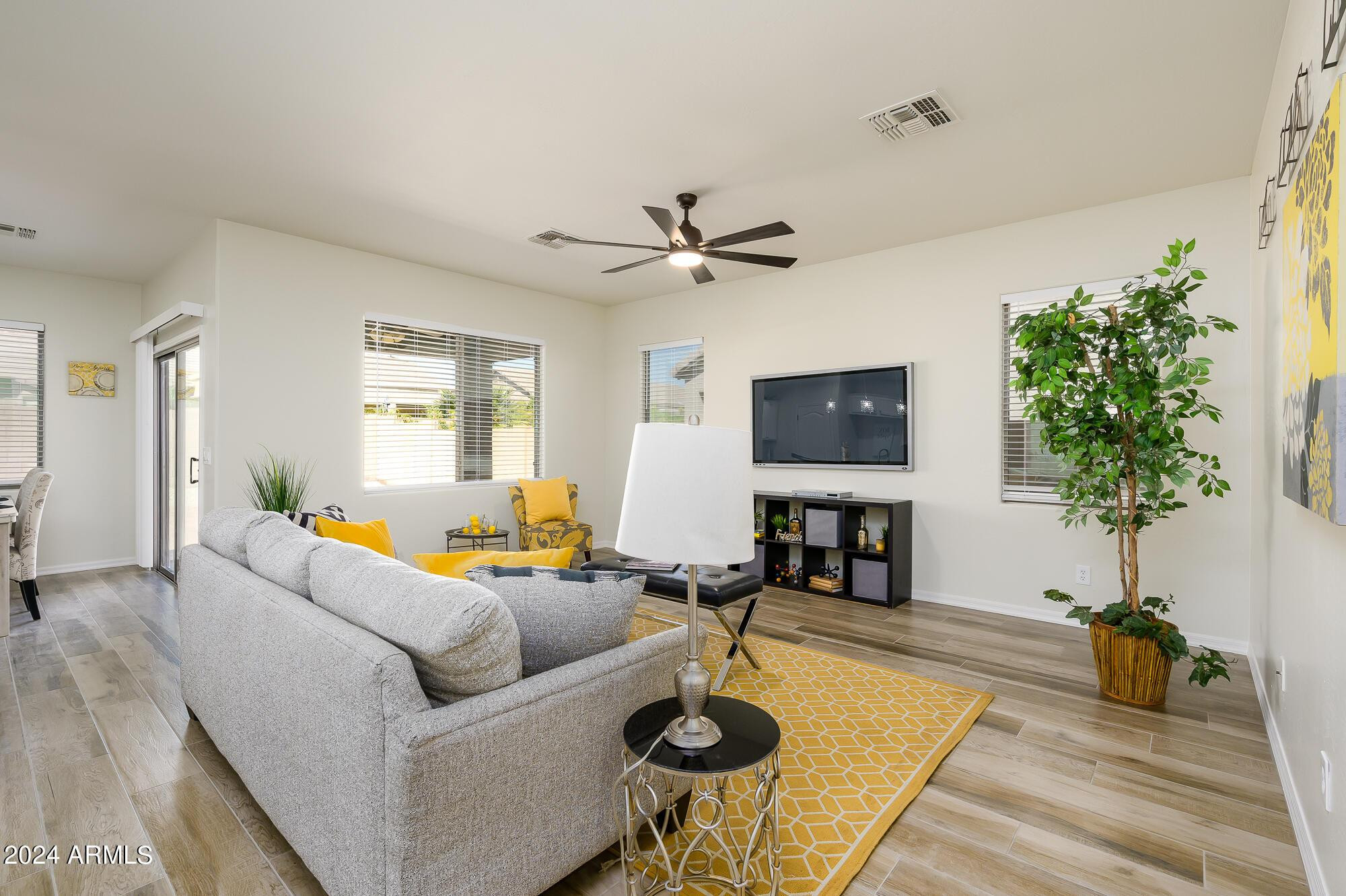 17618 West Crocus Drive Surprise, AZ 85388 - Photo 14 of 34 a living room with furniture and a flat screen tv