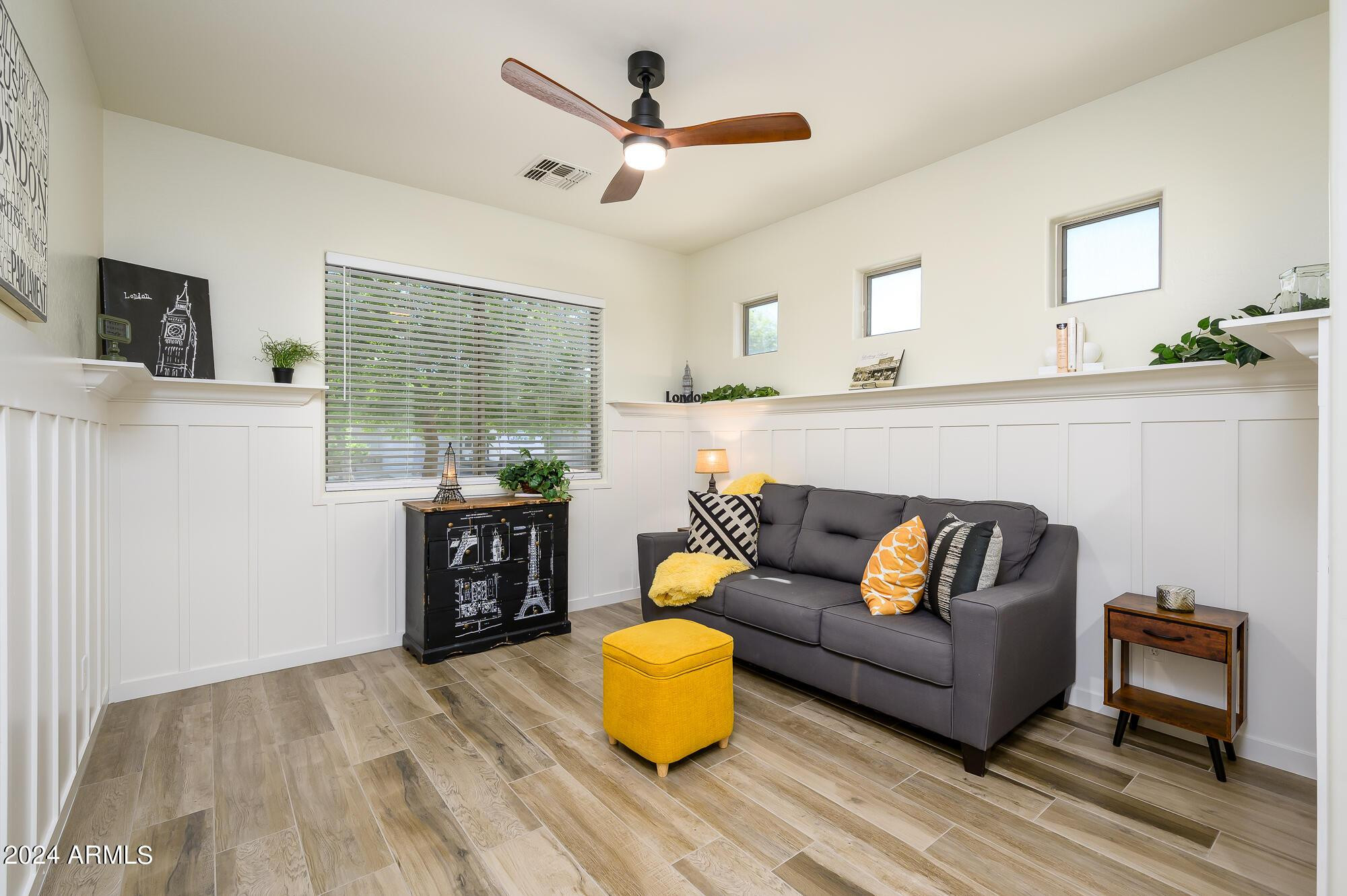 17618 West Crocus Drive Surprise, AZ 85388 - Photo 5 of 34 a living room with furniture and a wooden floor