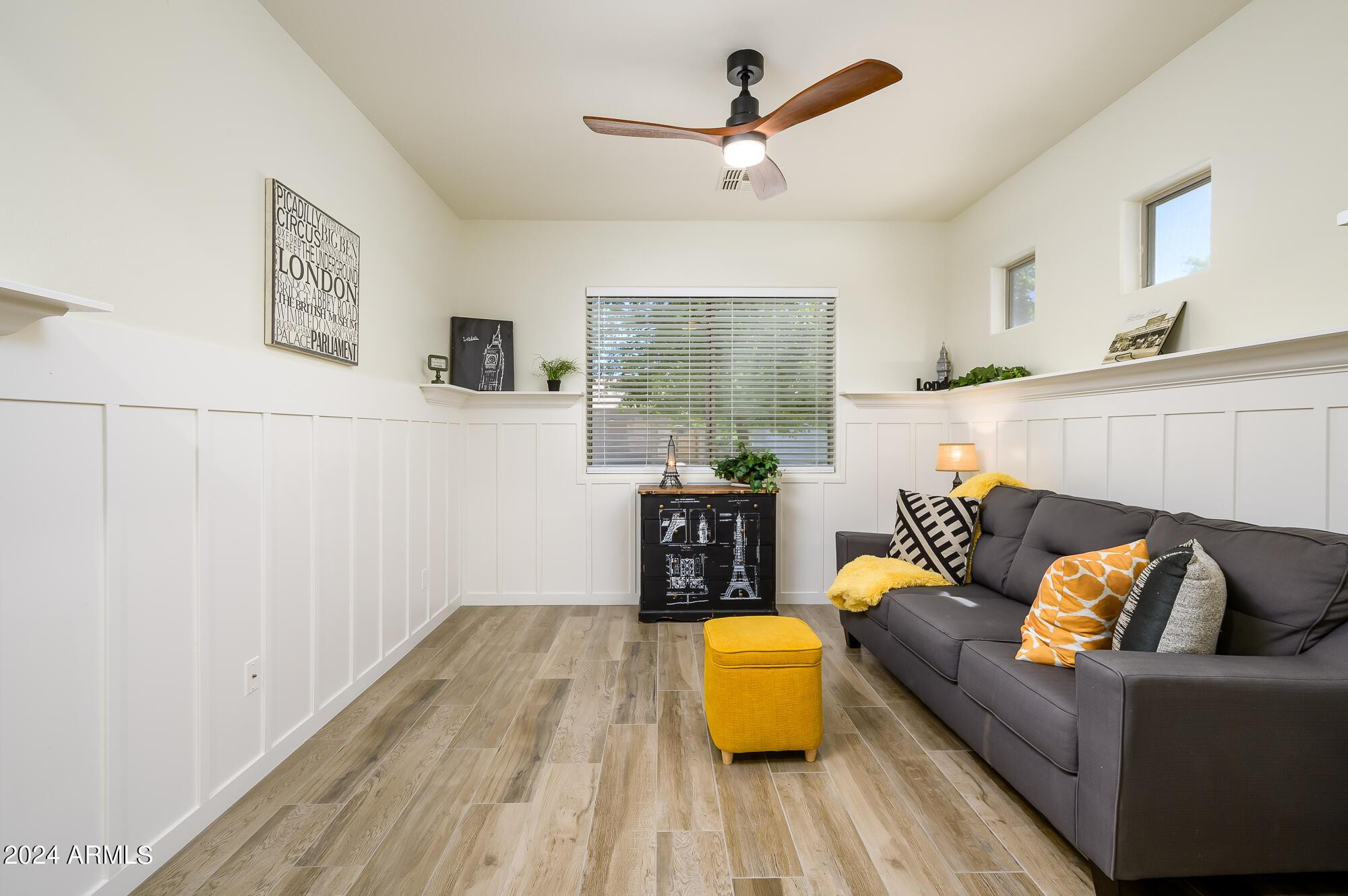 17618 West Crocus Drive Surprise, AZ 85388 - Photo 6 of 34 a living room with furniture and a wooden floor
