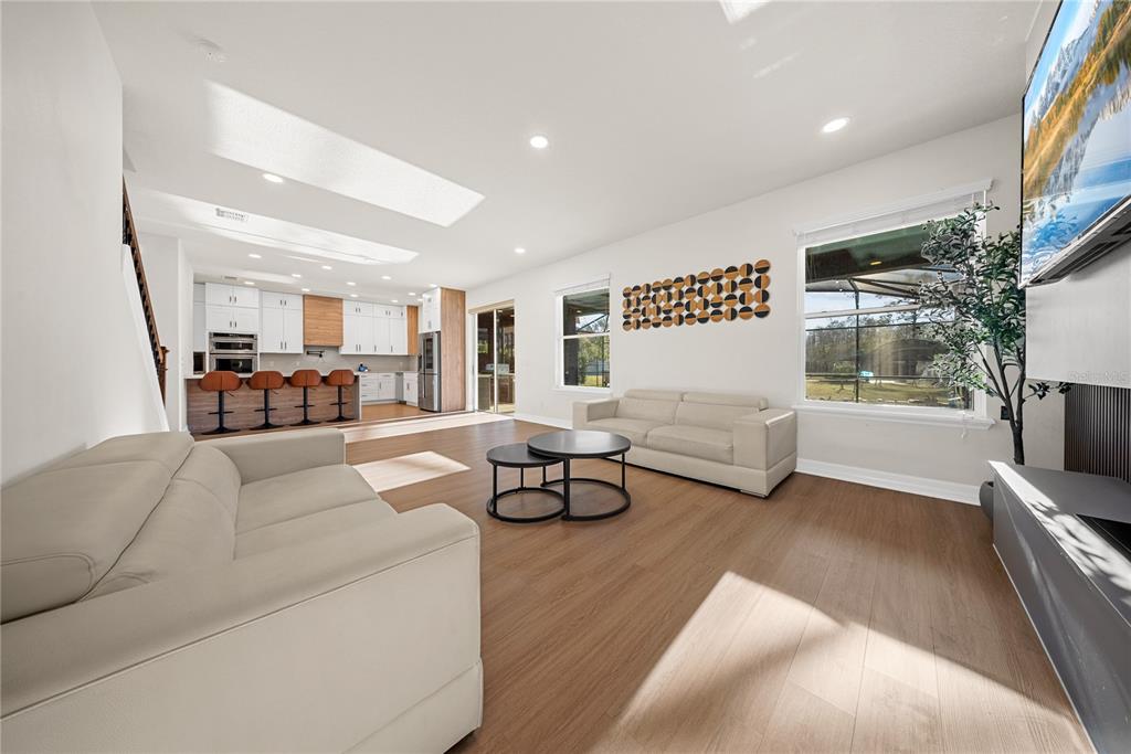 8252 Randal Park Boulevard Orlando, FL 32832 - Photo 19 of 63 a living room with furniture and a flat screen tv