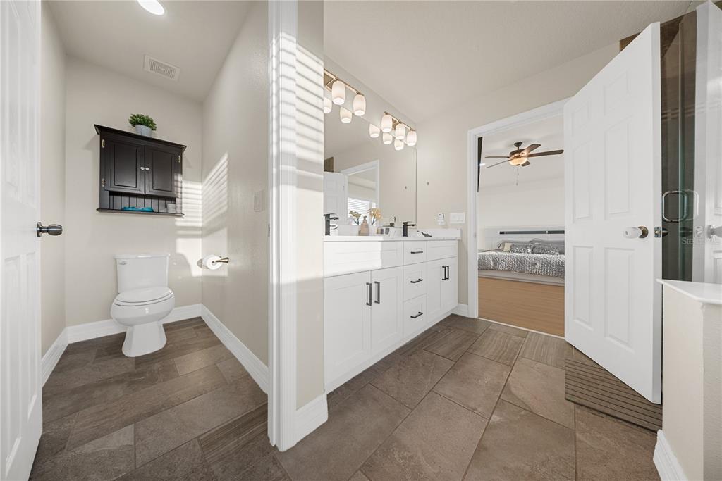 8252 Randal Park Boulevard Orlando, FL 32832 - Photo 29 of 63 a large white kitchen with a stove a sink dishwasher and a refrigerator with white cabinets