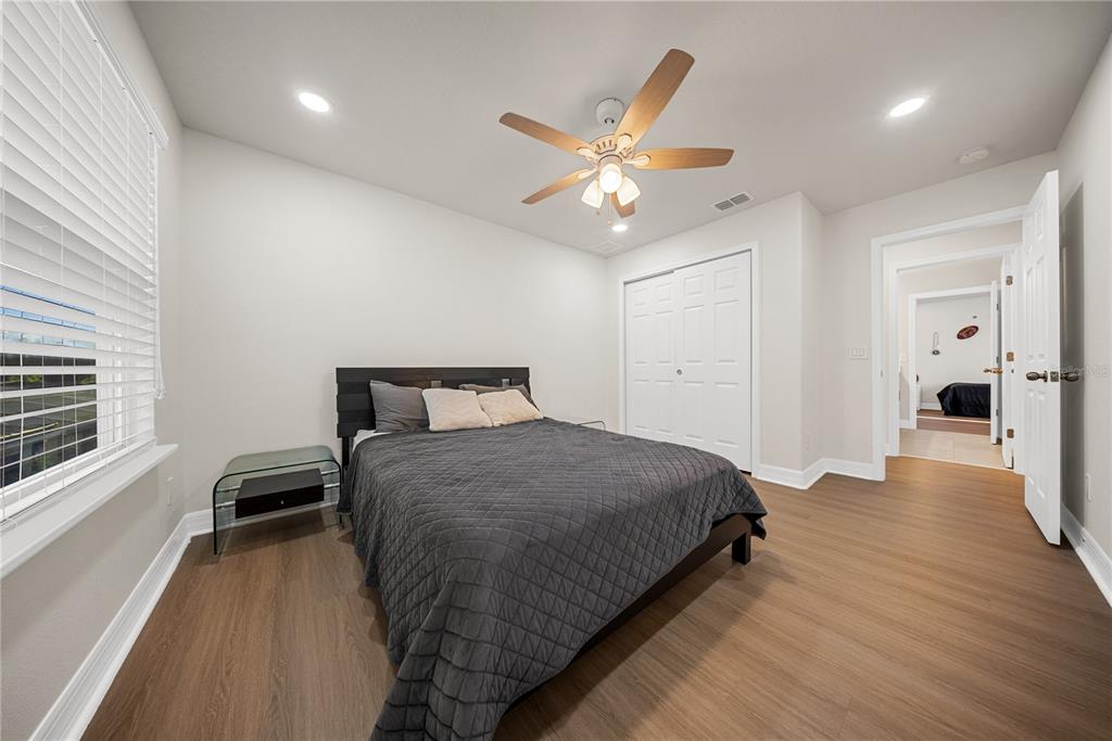 8252 Randal Park Boulevard Orlando, FL 32832 - Photo 41 of 63 a bedroom with a bed and a window