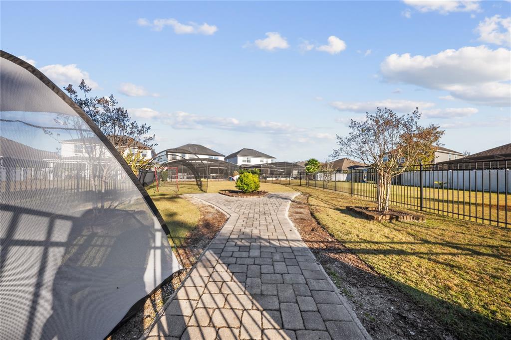 8252 Randal Park Boulevard Orlando, FL 32832 - Photo 55 of 63 a view of a swimming pool with an outdoor seating