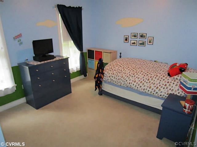 7950 Millvale Road Chesterfield, VA 23832 - Photo 11 of 18 a bedroom with a bed and flat screen tv