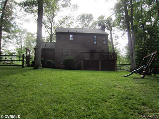 7950 Millvale Road Chesterfield, VA 23832 - Photo 16 of 18 a view of a backyard with a garden