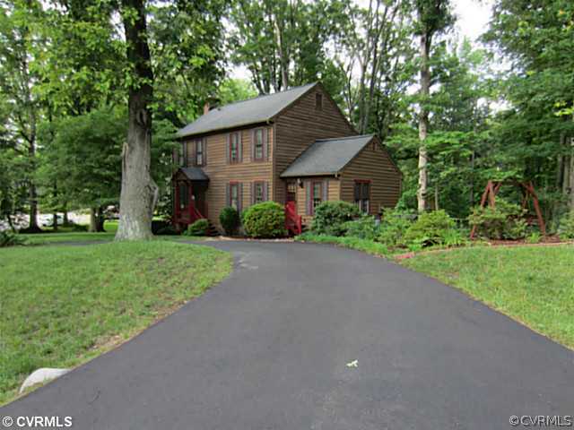 7950 Millvale Road Chesterfield, VA 23832 - Photo 17 of 18 a front view of a house with garden
