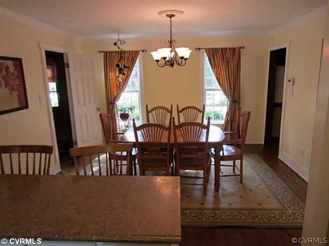 7950 Millvale Road Chesterfield, VA 23832 - Photo 4 of 18 a dining room with furniture window and wooden floor