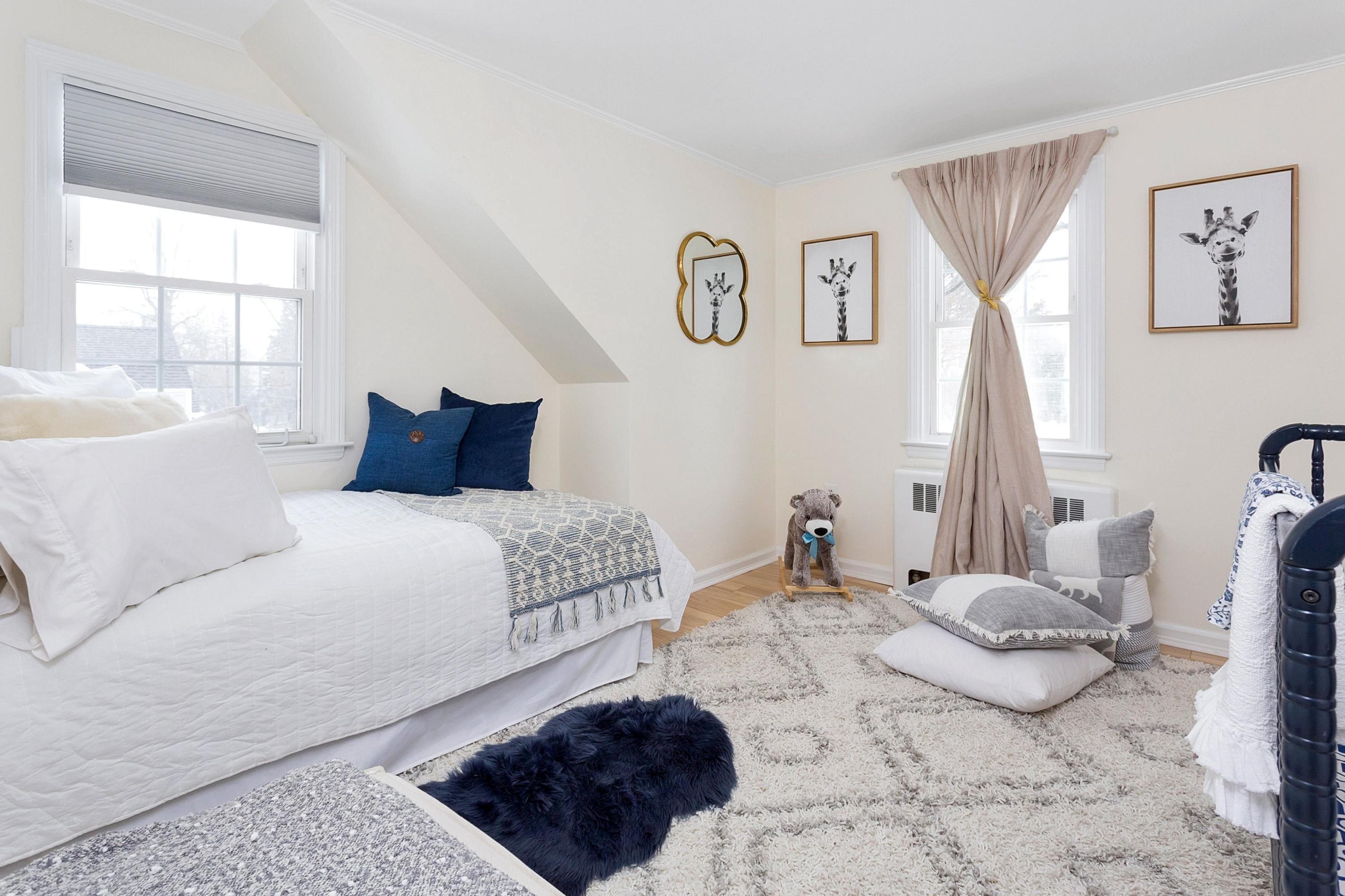 39 Walmsley Road Darien, CT 06820 - Photo 22 of 34 a bedroom with a bed and a window