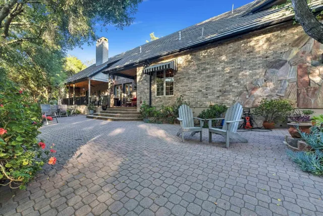 a living room with lots of furniture and a wooden floor