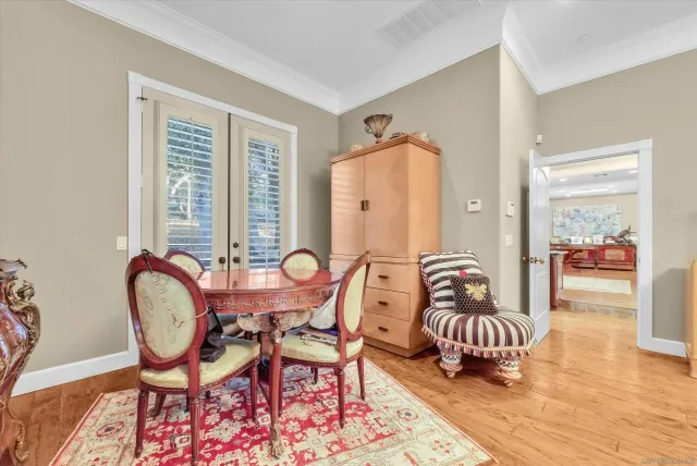 a backyard of a house with barbeque oven and outdoor seating