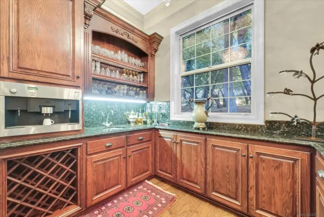 a view of a house with large trees