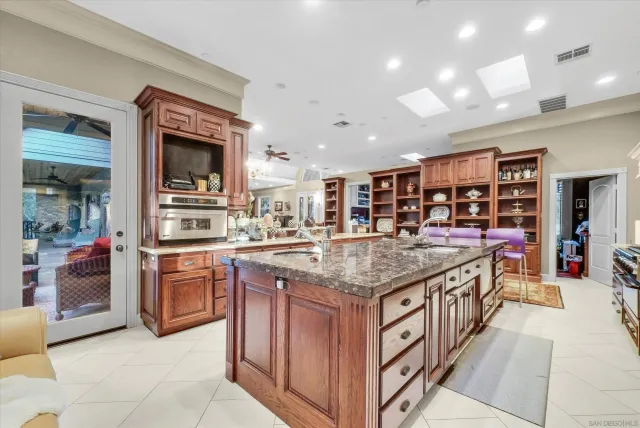 a view of a backyard with wooden fence