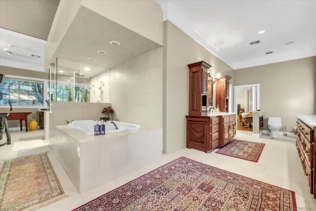 an aerial view of residential house with yard and mountain view in back