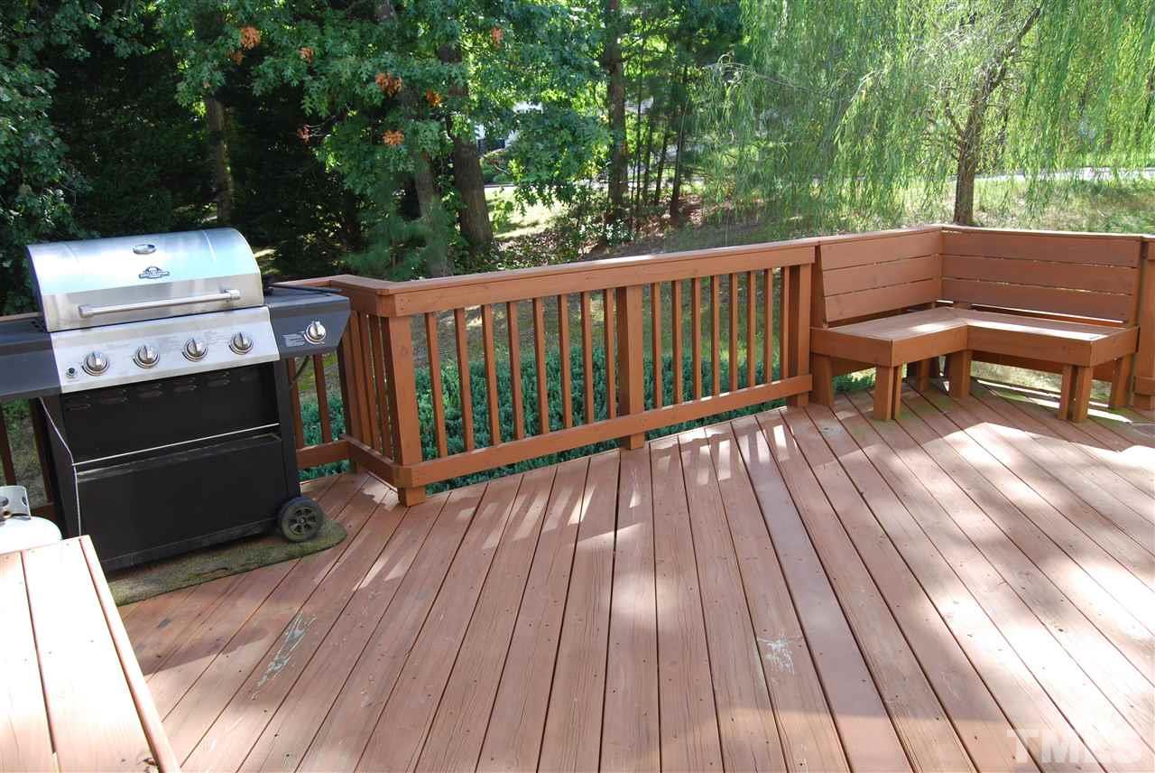 1502 Nealstone Way Raleigh, NC 27614 - Photo 22 of 25 a view of a deck with wooden floor and outdoor space