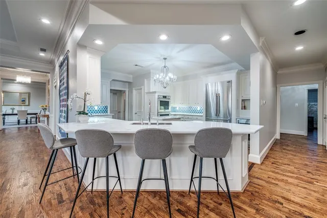 a dining room with furniture and wooden floor