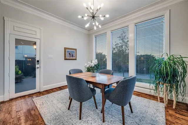 a kitchen that has a lot of cabinets in it with granite countertop a sink and dishwasher