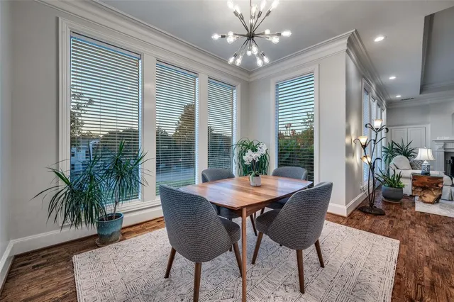 a view of a dining room with furniture and window