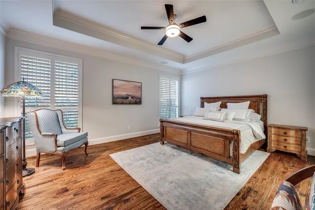 an empty room with potted plants and windows
